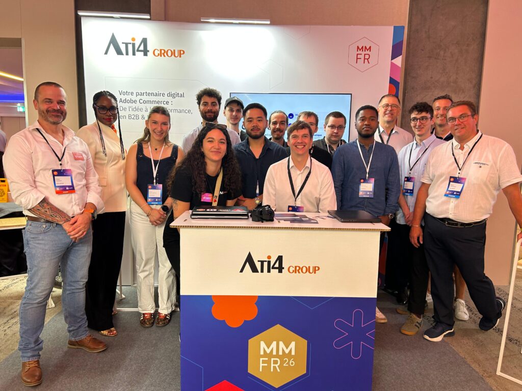 Photo de l'équipe ATI4 sur son stand à Meet Magento France.